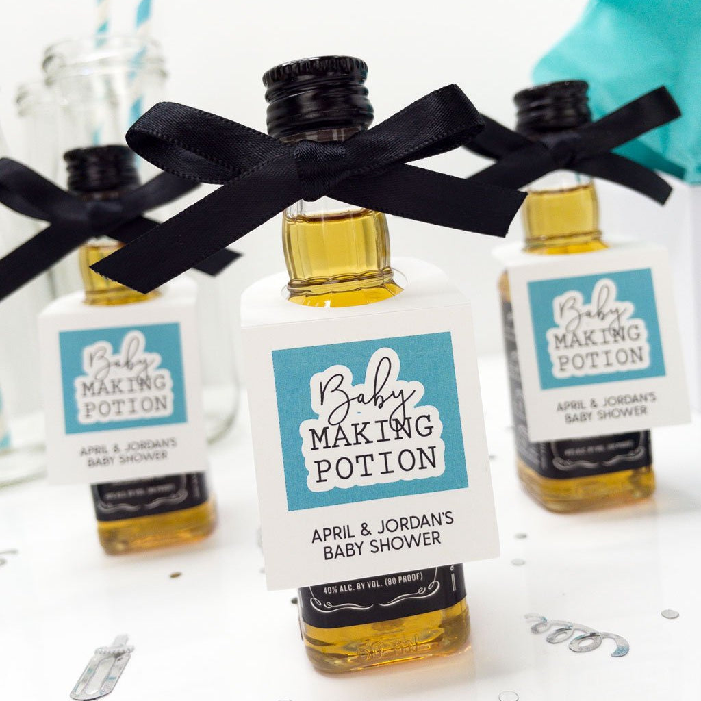 Baby shower liquor tags on mini bottles of bourbon