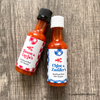 seafood boil party favors mini hot sauce bottles red and blue gingham