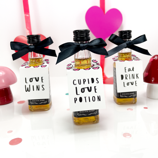 galentine's day party favor gift tags on mini liquor bottles