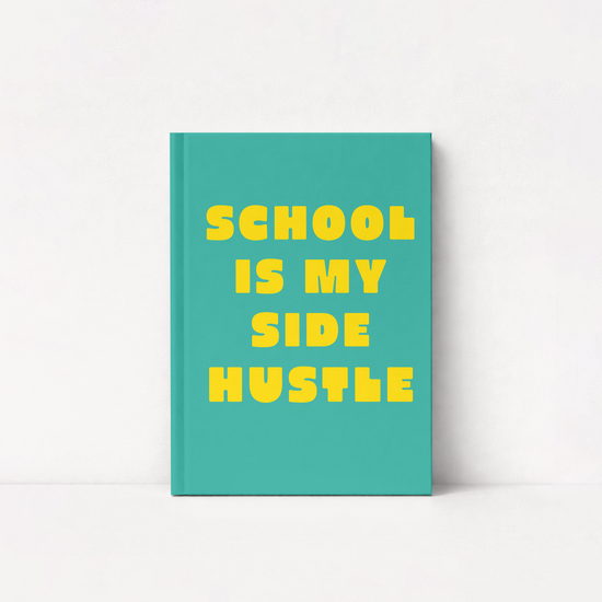 A teal hardcover notebook with bold yellow text reading 'SCHOOL IS MY SIDE HUSTLE' on a clean white background.