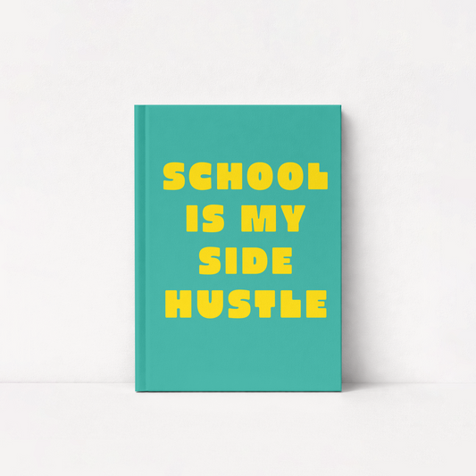 A teal hardcover notebook with bold yellow text reading 'SCHOOL IS MY SIDE HUSTLE' on a clean white background.