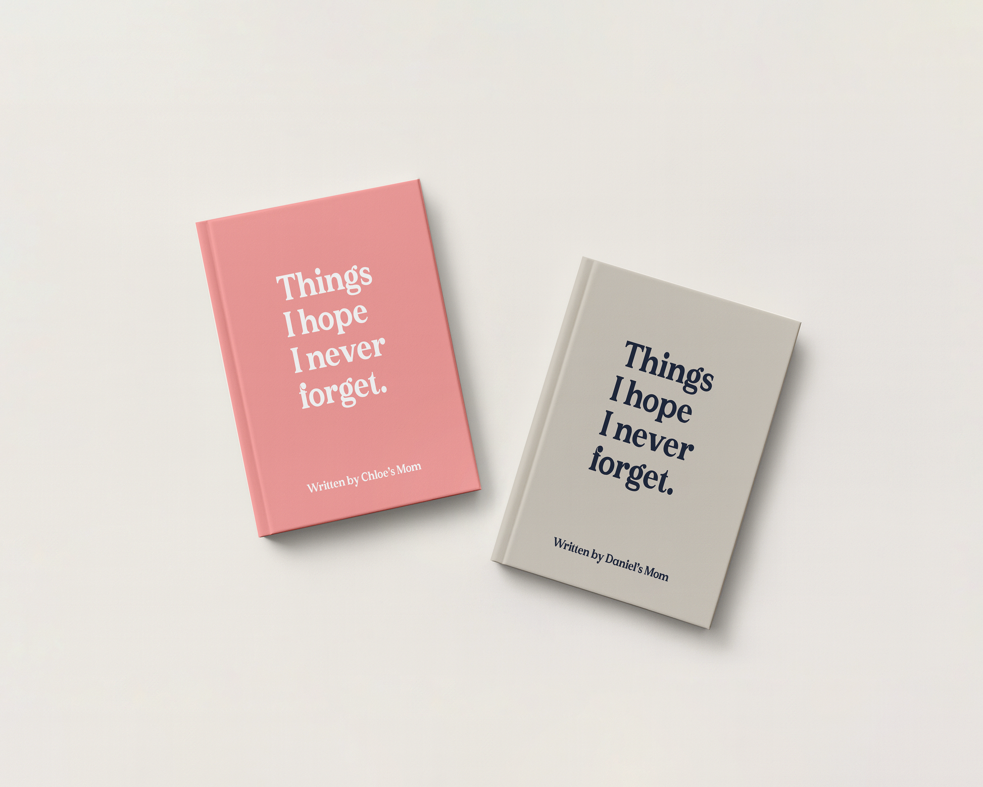 Two hardcover books titled "Things I hope I never forget." by authors Daniel's Mom, one in pink and one in light gray, displayed on a clean off-white background.