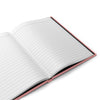 Open hard cover journal notebook with lined pages on a white background