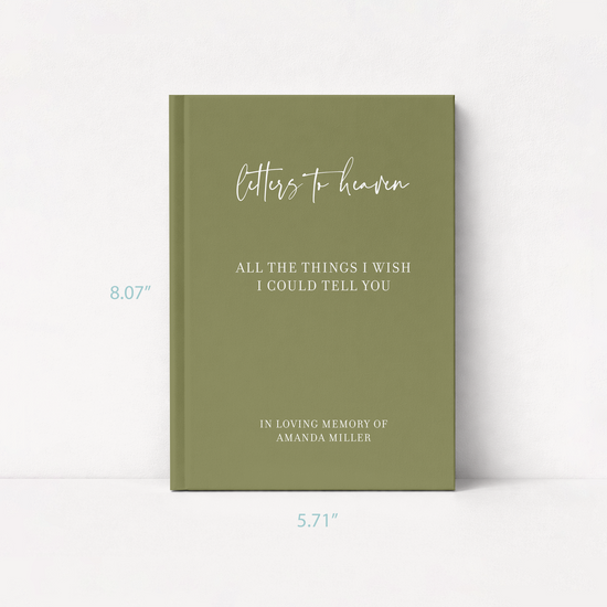 A personalized hardcover journal with an olive green cover, featuring white script and serif text that reads 'Letters to heaven' and 'All the things I wish I could tell you' with memorial details. T