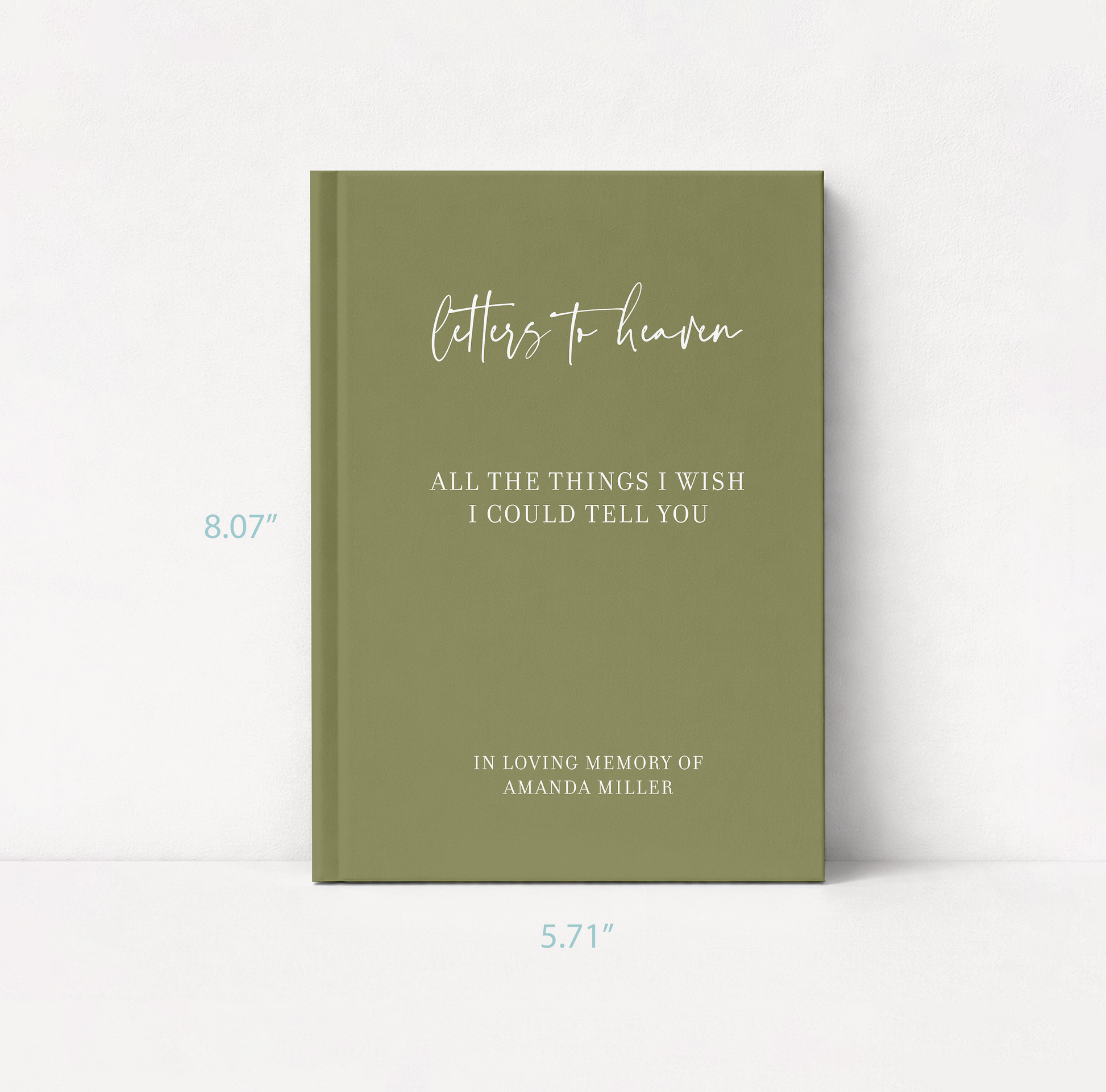 A personalized hardcover journal with an olive green cover, featuring white script and serif text that reads 'Letters to heaven' and 'All the things I wish I could tell you' with memorial details. T