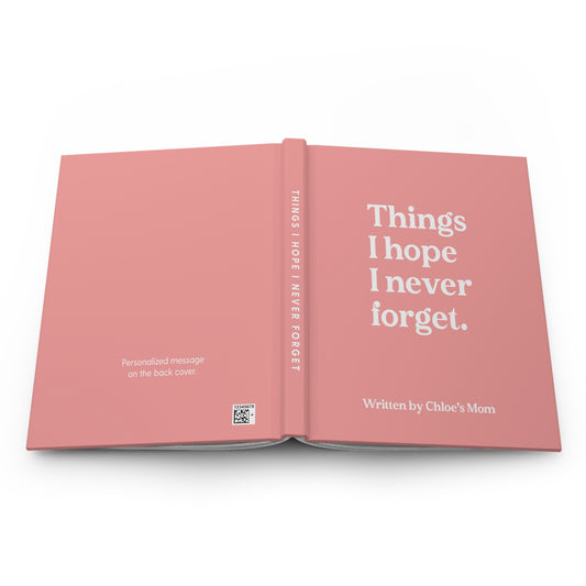 An open hardcover book in a dusty pink color, displaying the front cover with the white text 'Things I hope I never forget.' and the spine with 'THINGS I HOPE I NEVER FORGET.