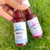 pink and blue labels on mini bottles of bbq sauce and hot sauce