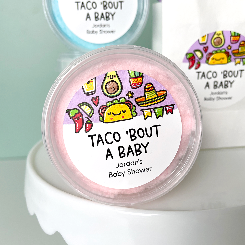 round baby shower stickers that read taco bout a baby on cotton candy favors