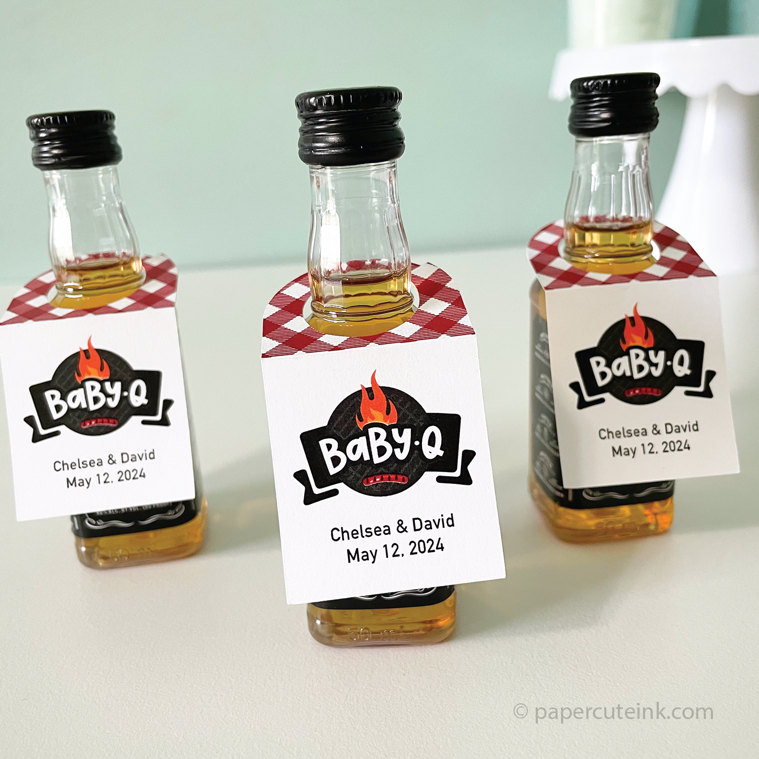 Barbecue baby shower bbq babyq favor tags for mini liquor bottles feature a red gingham pattern and barbecue grill and flame