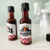 baby shower bbq sauce favors with red gingham pattern and barbecue grill