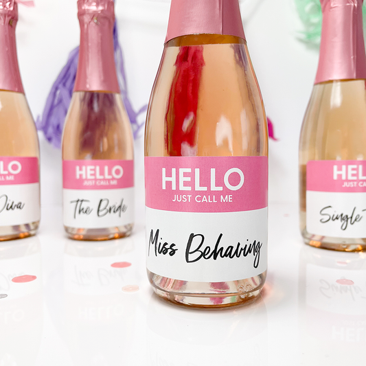 bachelorette party name labels on mini bottles of wine and champagen