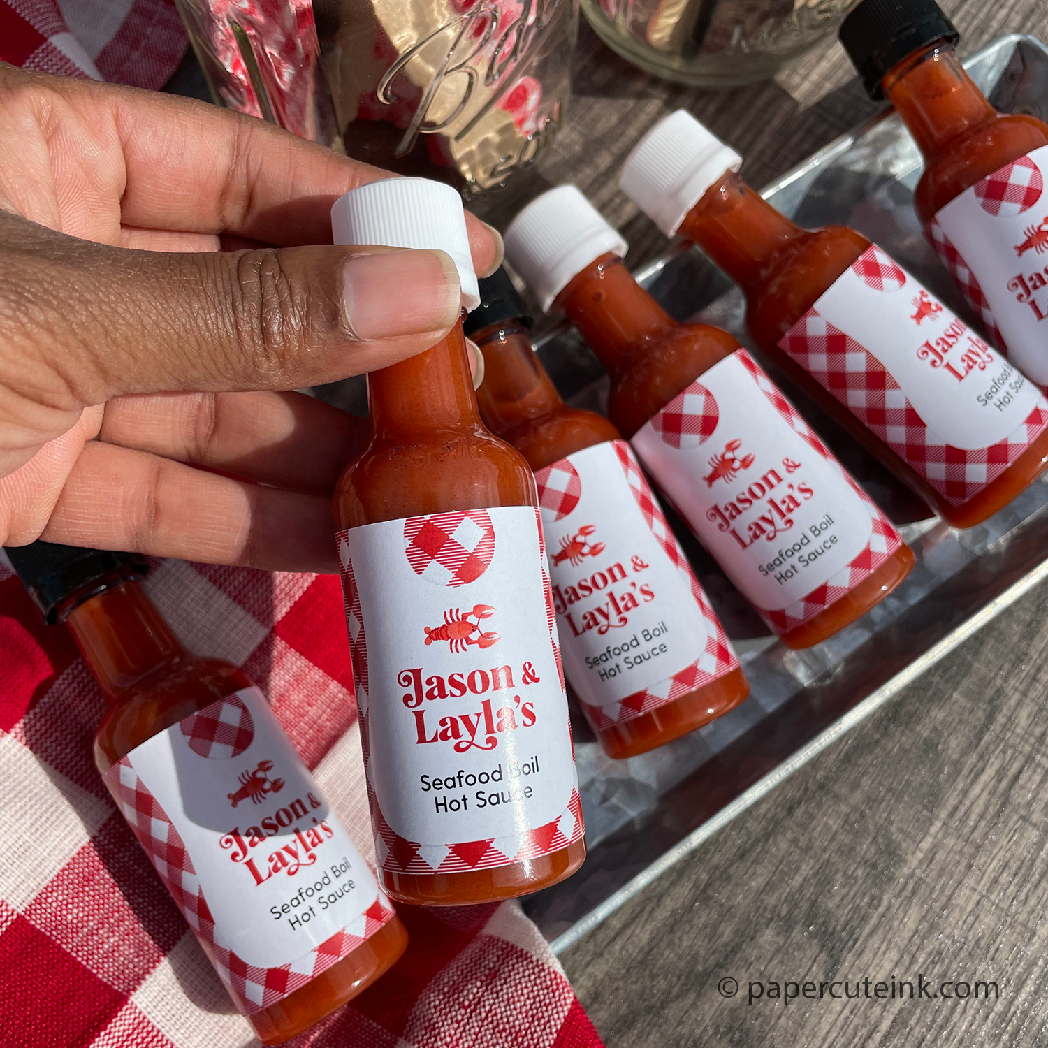 lobster bib party favors miniature bottles of hot sauce