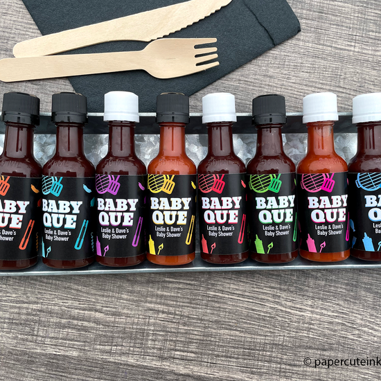 babyq baby shower favors mini bbq sauce bottles on a picnic table