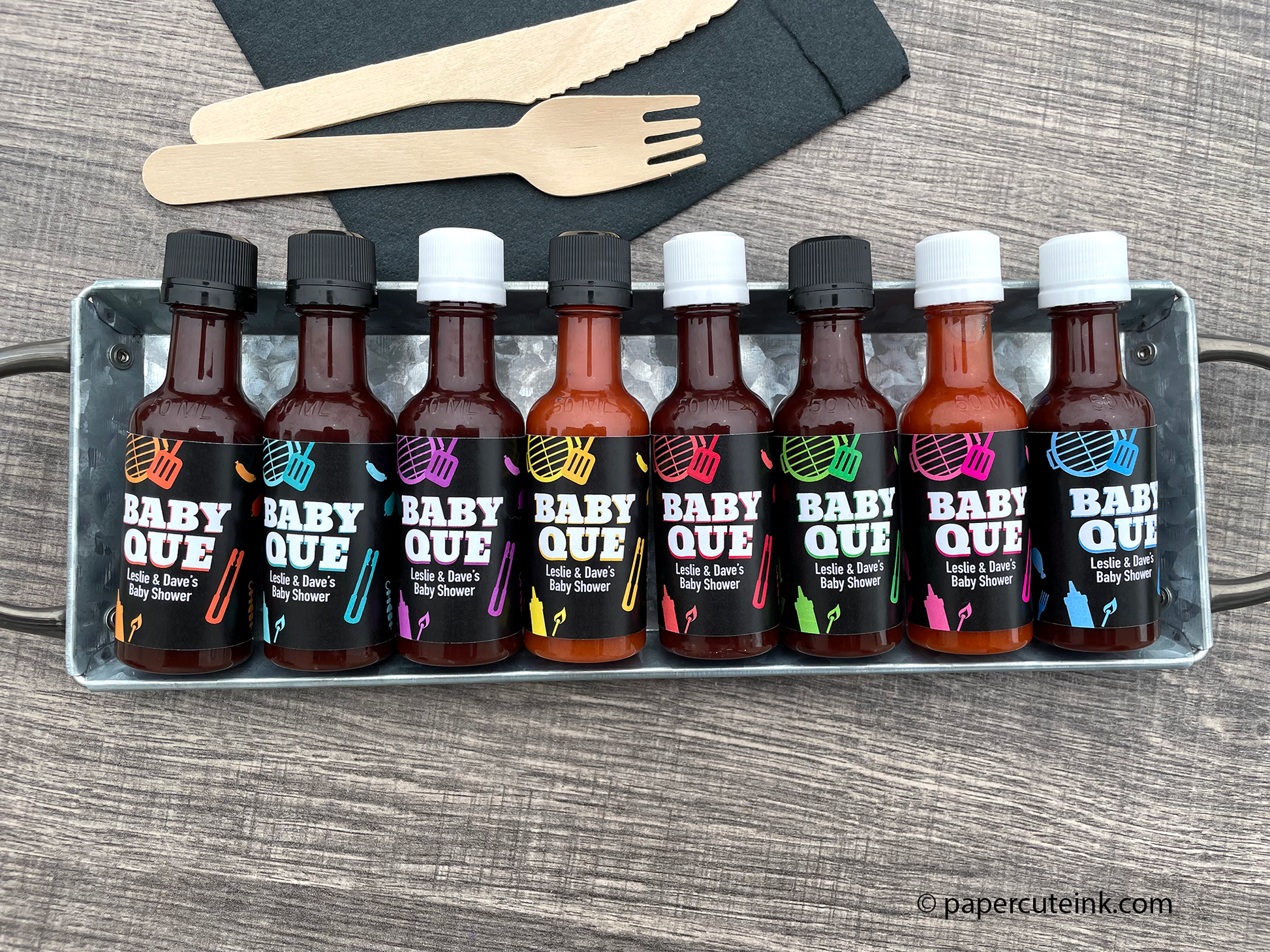 babyq baby shower favors mini bbq sauce bottles on a picnic table