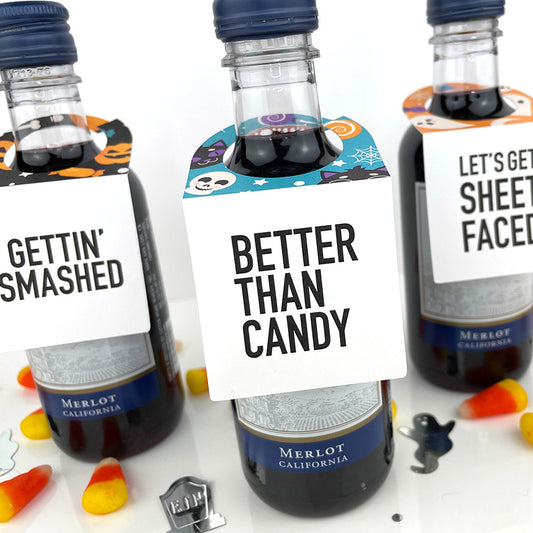 halloween mini wine bottle tags that read better than candy, gettin smashed and lets get sheet faced.