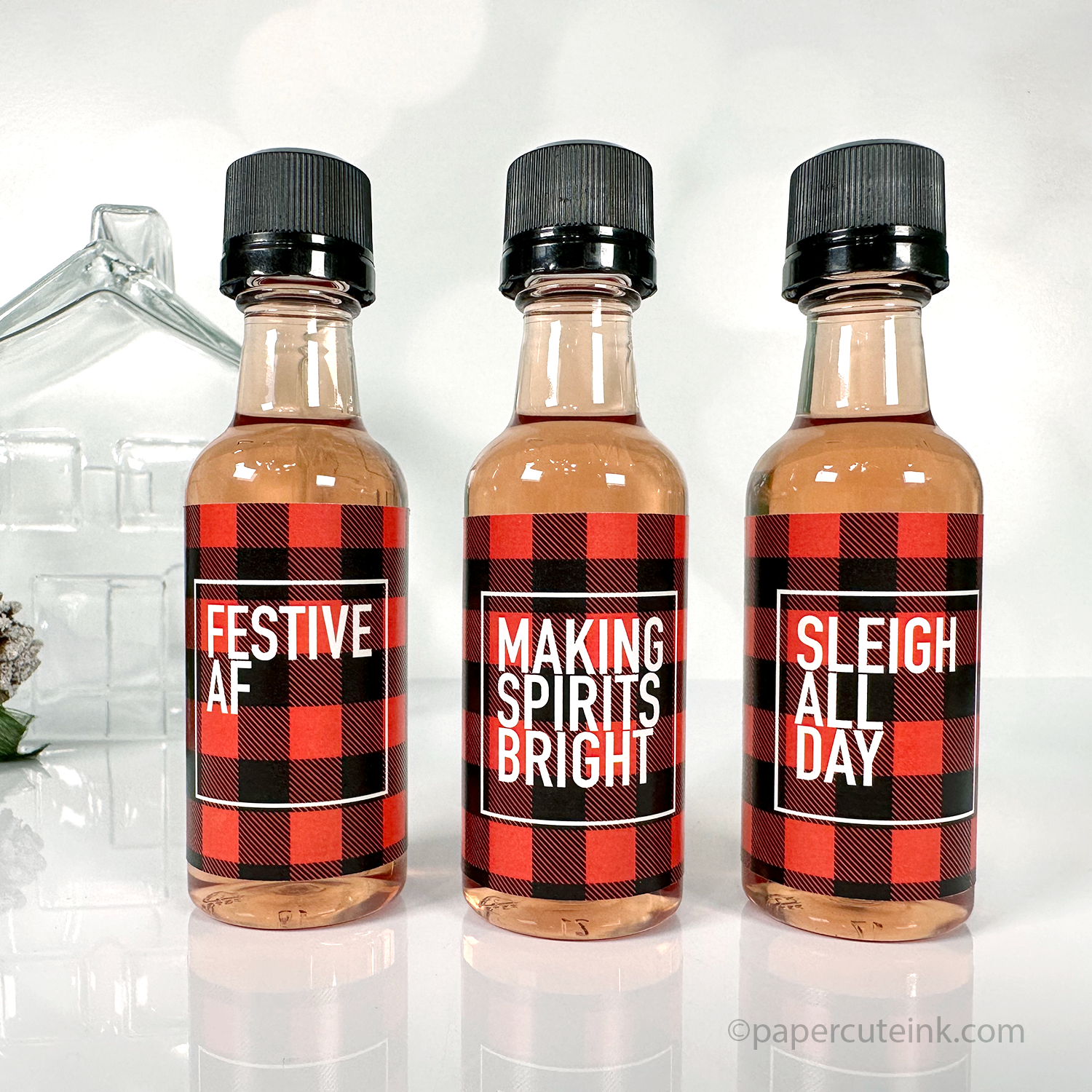 Festive AF red and black plaid holiday liquor bottle labels