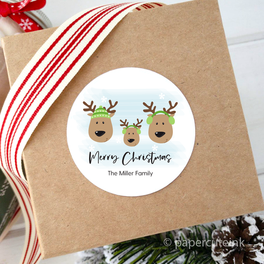 Personalized Christmas gift labels attached to a christmas present